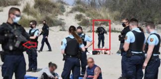 Welkom in het Nieuwe Normaal: met machinegeweren en een groot contingent politie tegen het drinken van een wijntje op een Frans strand