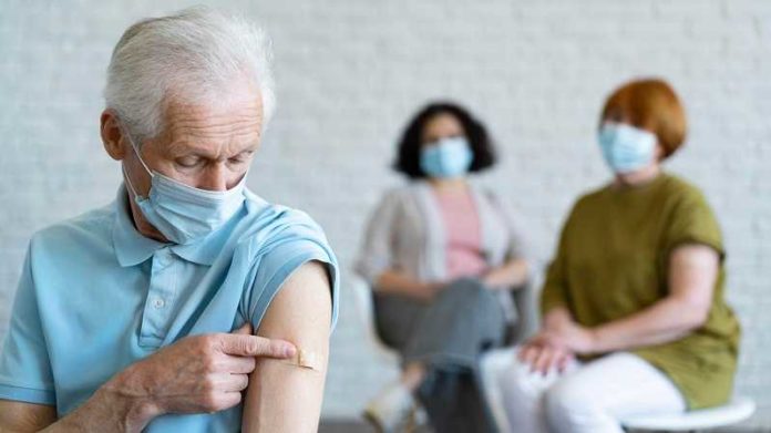 man-with-bandage-arm-after-vaccination