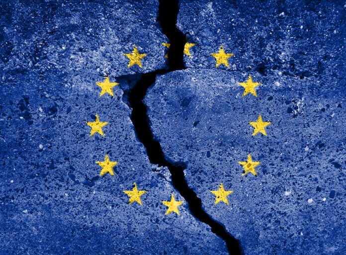 Blue european union EU flag on broken wall. EU destruction symbo